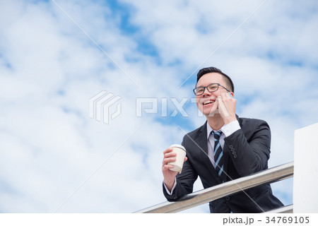 Young businessman wearing black suit smiling Young businessman wearing black suit smiling 34769105