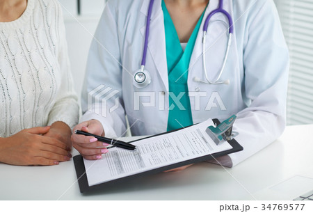 Doctor and patient, close-up of hands. Physicia Doctor and patient, close-up of hands. Physicia 34769577