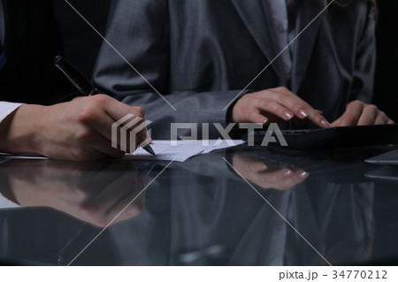 Group of businesspeople or lawyers at meeting. Low Group of businesspeople or lawyers at meeting. Low 34770212