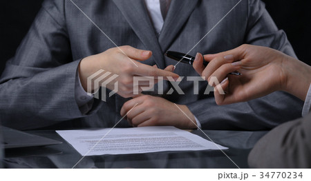 Group of businesspeople or lawyers at meeting. Low 34770234