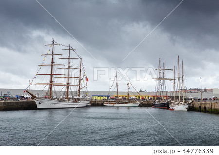 Ancient sailboats moored in port Sines, Portugal Ancient sailboats moored in port Sines, Portugal 34776339
