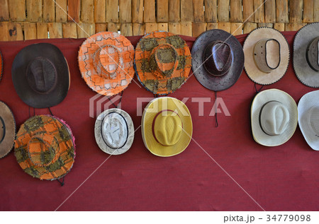 Hung many styles of hat on the wall Hung many styles of hat on the wall 34779098