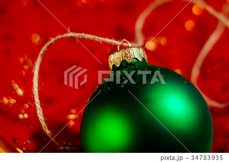 new year green ball on red background new year green ball on red background 34783935