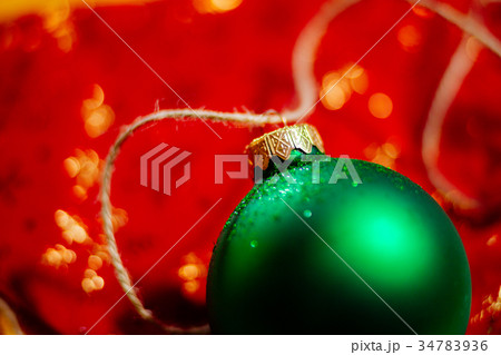 new year green ball on red background 34783936