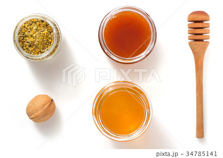 jar of honey on white background jar of honey on white background 34785141