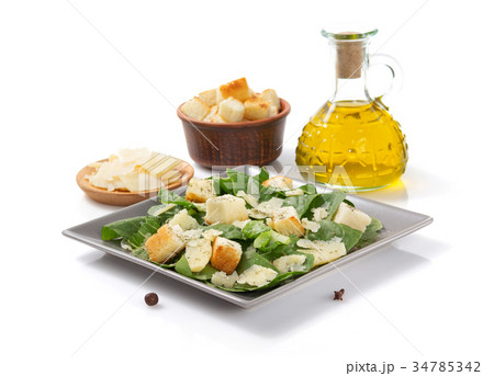 caesar salad in plate on white background 34785342