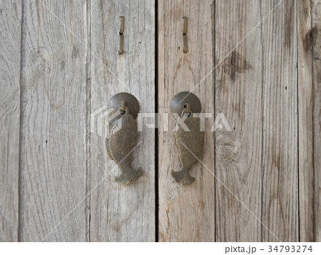 Fish door handle on the wood. Fish door handle on the wood. 34793274