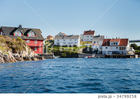 view on norwegian fjord with houses along 34799258