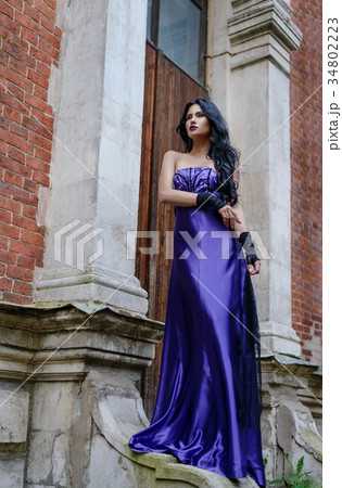 Beautiful witch in lilac dress 34802223