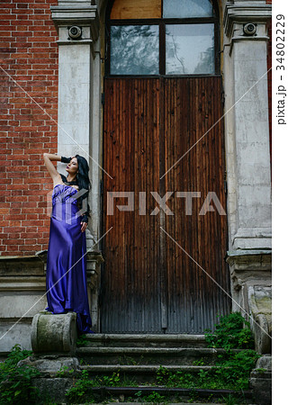 Beautiful witch in lilac dress 34802229