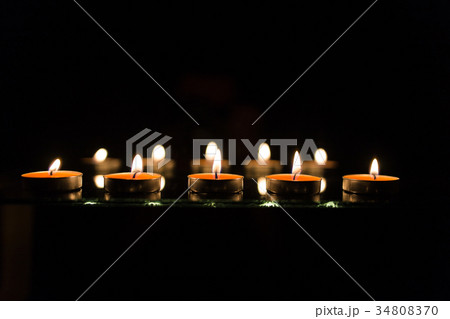 Many burning candles with shallow depth of field 34808370