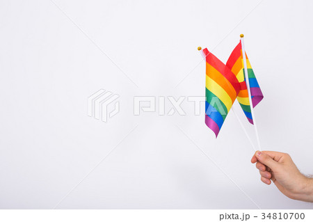 Man Holding LGBT Flags Close up with copy space 34810700