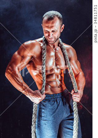 Strong man with rope 34811751