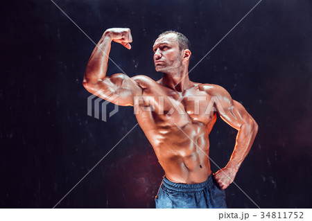 Strong bald bodybuilder with six pack. Strong bald bodybuilder with six pack. 34811752