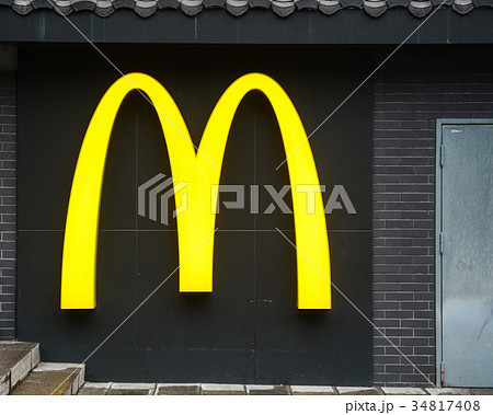 McDonald Restaurant logo on the dark wall McDonald Restaurant logo on the dark wall 34817408