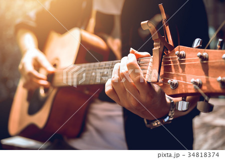 Asian hipster man left hand catch chord 34818374