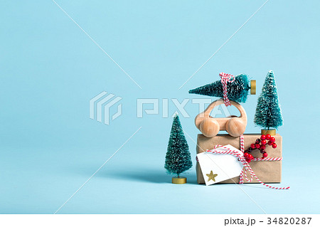 Gift box with miniature Christmas trees 34820287