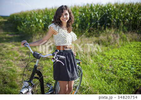 Pretty girl with bike 34820754
