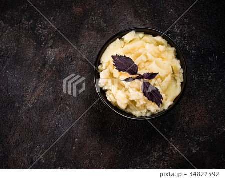 Mashed potatoes on dark concrete background Mashed potatoes on dark concrete background 34822592