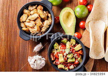 Ingredients ready for preparing chicken tacos Ingredients ready for preparing chicken tacos 34825994