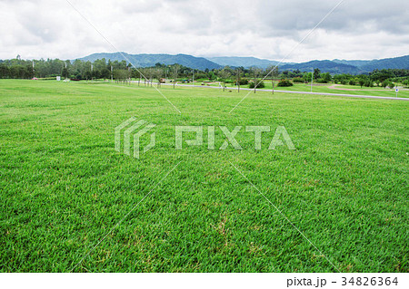 Lawn with mountain background. Lawn with mountain background. 34826364