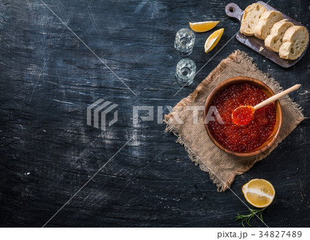 Red caviar in a wooden bowl 34827489