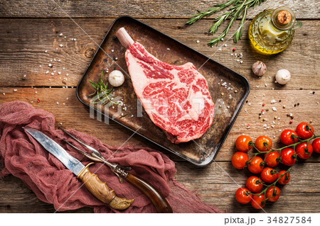 Raw tomahawk beef steak 34827584