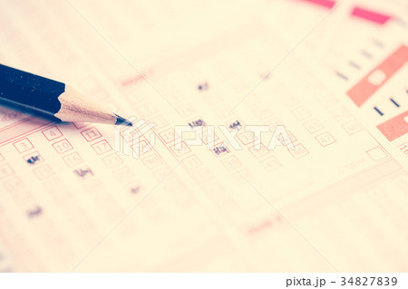 Image above of lottery ticket with pencil 34827839