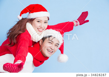 couple smile with merry christmas couple smile with merry christmas 34828287