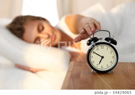 Beautiful young woman sleeping and smiling while 34829065