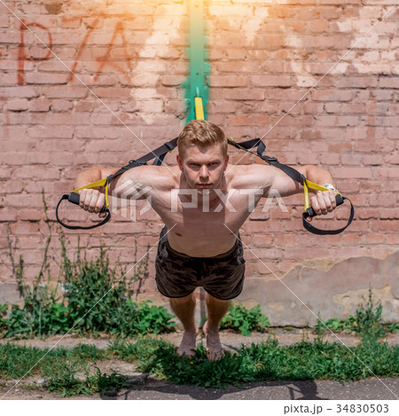 A male athlete is engaged in open air loops 34830503