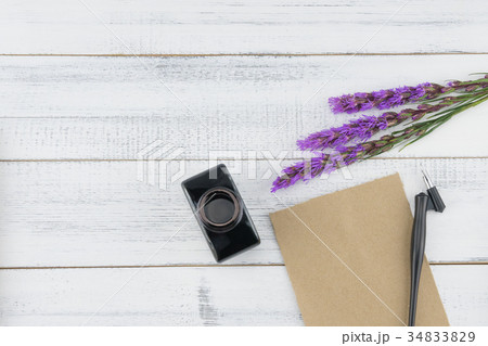 Blank brown card, oblique pen and bottle of ink 34833829