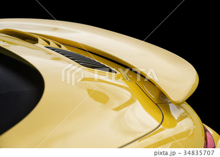Close up on yellow sport car rear spoiler 34835707