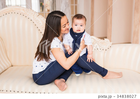Adorable Caucasian baby boy with his mother 34838027