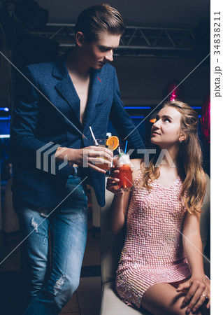 Flirty relationships. Night club party background Flirty relationships. Night club party background 34838211