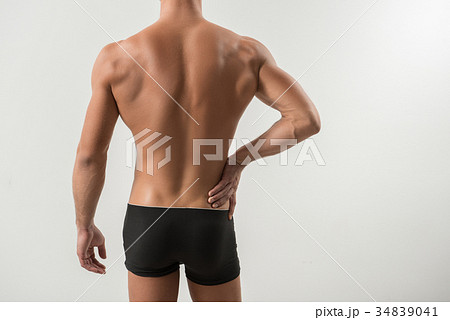 Charming nude man is feeling hurt in his body 34839041