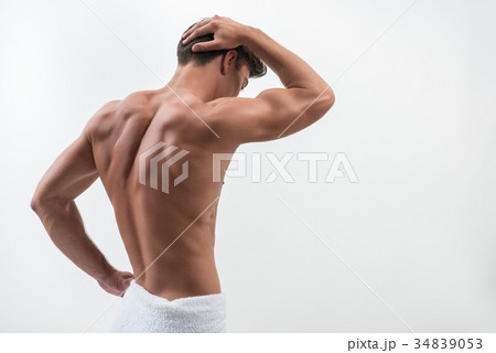 Rear view of charming muscular guy Rear view of charming muscular guy 34839053