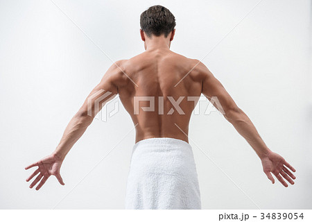 Rear view of sexual muscular youthful man Rear view of sexual muscular youthful man 34839054