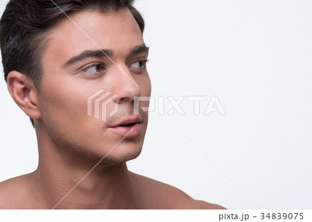 Charming nude guy is standing pensively 34839075