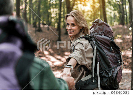Joyful married couple going on pathway in the Joyful married couple going on pathway in the 34840085