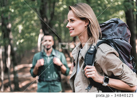 Joyful couple walking in forest together 34840125