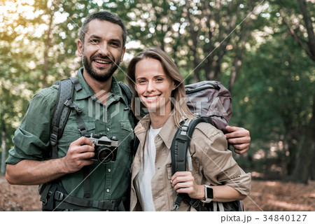 Joyful man and woman taking photos of nature 34840127