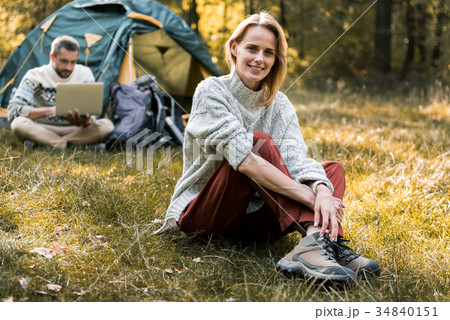 Cheerful married couple relaxing in forest 34840151