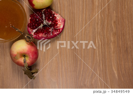 Pieces ripe pomegranate, honey and apple 34849549