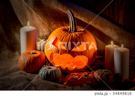 Halloween pumpkin head with burning candles Halloween pumpkin head with burning candles 34849816