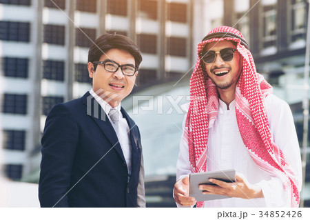 Arab man and business man discussion Arab man and business man discussion 34852426