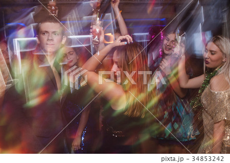 Dancing at night club in blurred motion Dancing at night club in blurred motion 34853242