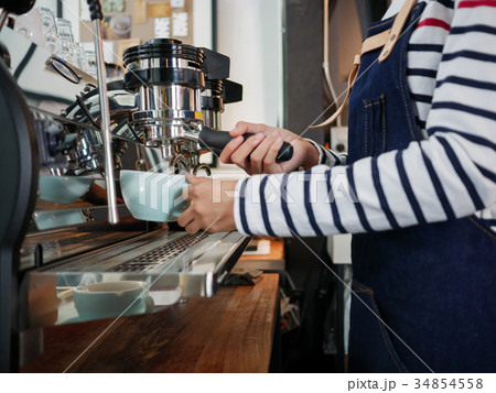 Close up hand of barista brewing coffee. Close up hand of barista brewing coffee. 34854558
