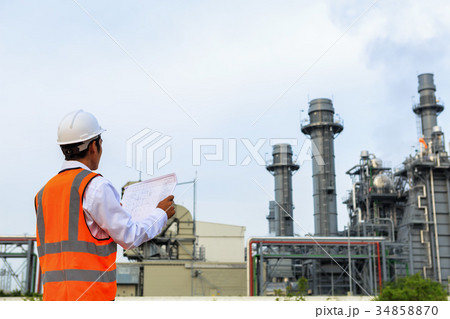 Engineer is checking gas turbine power plant Engineer is checking gas turbine power plant 34858870