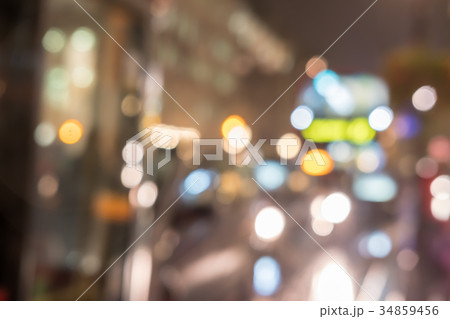 Blurred image of cars and red bus on the road 34859456